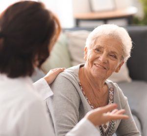 Older woman talking to doctor