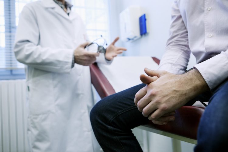 Man receiving consultation to doctor